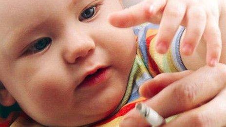 Baby exposed to cigarette smoke