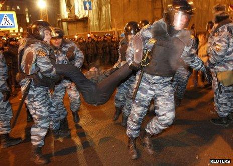 Riot police remove a protester in Moscow, 5 March