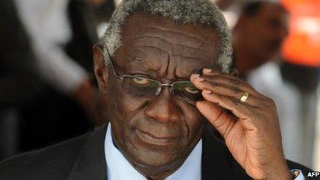 Former Ghanaian President John Kufuor adjusts his glasses during the ceremony marking Ghanaian first oil production in Takoradi on December 15, 2010