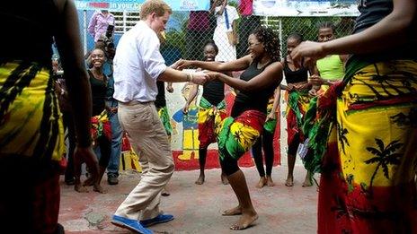 Prince and a lady do a reggae move