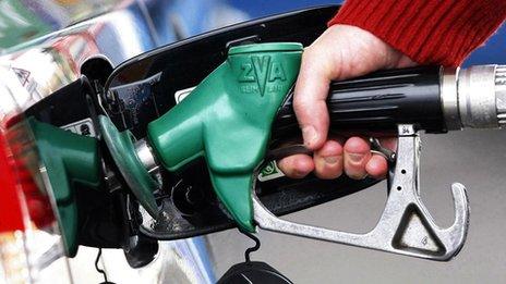 A person using a petrol pump