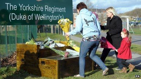 People laying tributes