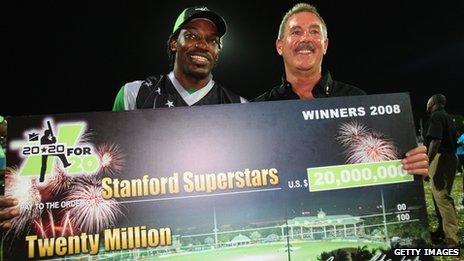 Cricketer Chris Gayle and Allen Stanford pose with a giant cheque during the Stanford Twenty20 Super Series in November 2008