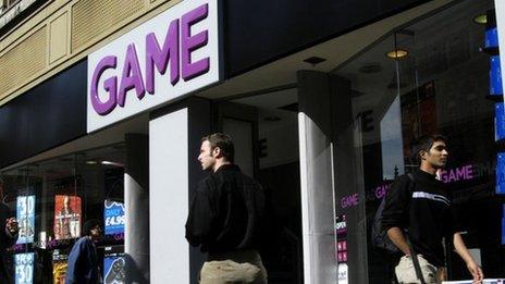 Shoppers pass a Game store in a high street