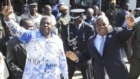 President Rupiah Banda (r) waves to supporters at a rally in Lusaka earlier this month