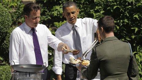 Barack Obama and David Cameron serve burgers in the Downing Street garden in 2011