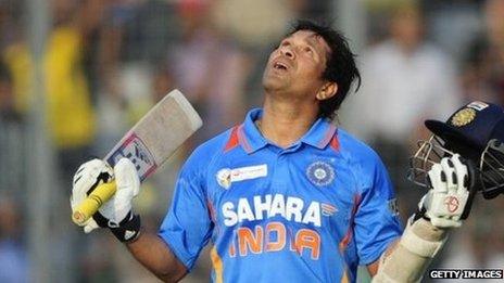 Sachin Tendulkar celebrates scoring his 100th international century