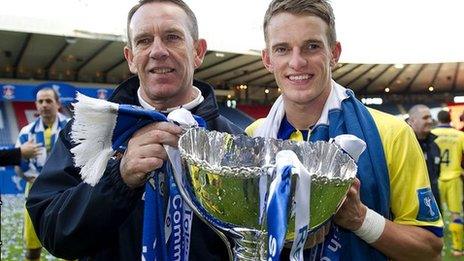 Kilmarnock manager Kenny Shiels celebrates with his son Dean