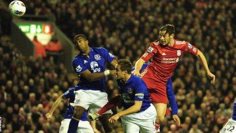 Sylvain Distin and Andy Carroll