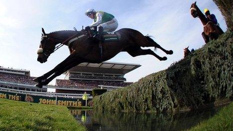 Ballabriggs ridden by Jason Maguire jumps the water jump on his way to winning the Grand National at Aintree Racecourse