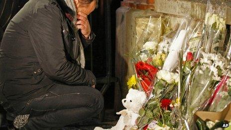 A man cries at a makeshift shrine at the Ozar Hatorah Jewish school in Toulouse