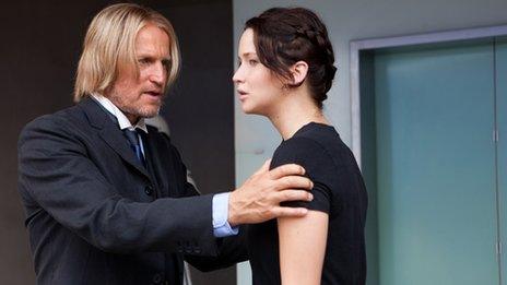 Haymitch Abernathy (Woody Harrelson) and Katniss Everdeen (Jennifer Lawrence) in The Hunger Games. Photo credit: Murray Close