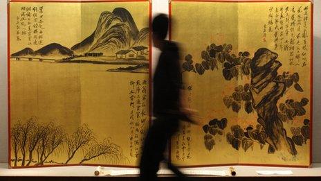 A rare pair of gold screens by Chinese artist Qi Baishi at a Sothebys auction preview