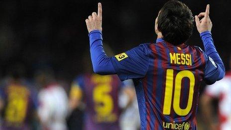 Lionel Messi celebrates after equalling Barcelona's 60-year-old goal-scoring record