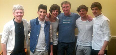 Matt Wells, in blue, with One Direction