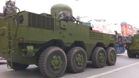 Chinese military vehicle on unidentified city street