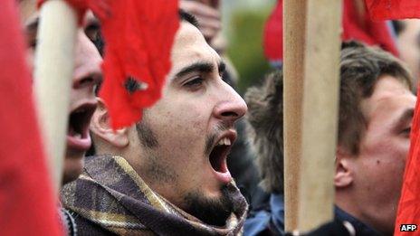 Students shout at a protest of austerity cuts in Athens in February