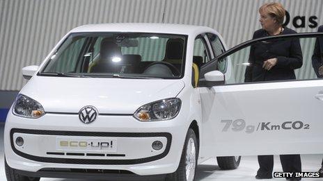 German Chancellor Angela Merkel inspects a Volkswagen Up at the Frankfurt motor show in September 2011