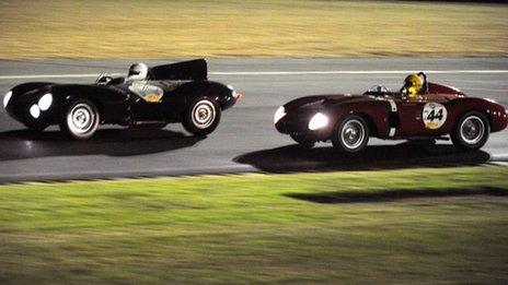 British driver Peter Neumark in his Jaguar Type D competes ahead French driver Nicolas Zapata in his Ferrari 625 Testarossa during the 5th edition of the 'Le Mans classic race' on July 10, 2010