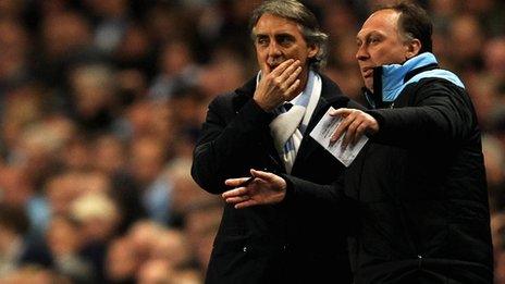 Manchester City boss Roberto Mancini (left) with assistant David Platt