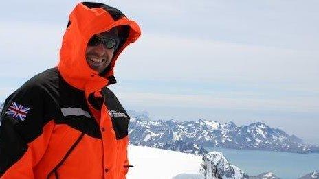 Mike Curtis stands in the Antarctic