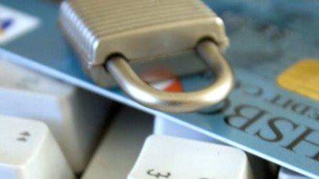 Padlock on top of credit card and keyboard