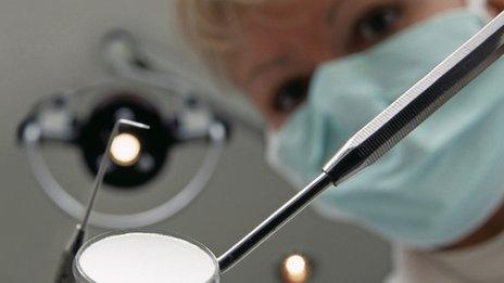 Patient's view of a dentist during a dental check-up