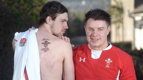 John Adam shows his Wales tattoo with friend James Griffiths