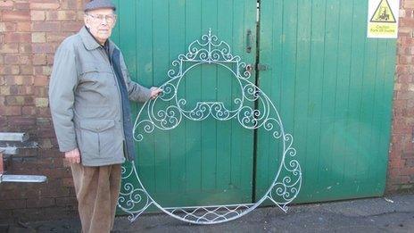 Dennis Pegg with the reclaimed Walberswick village sign