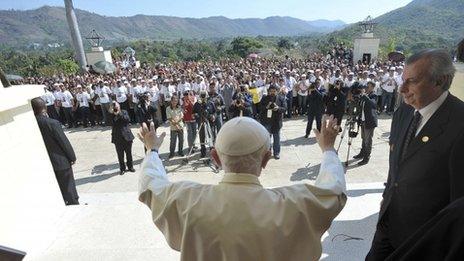 Pope Benedict waves to a crowd in Santiago de Cuba