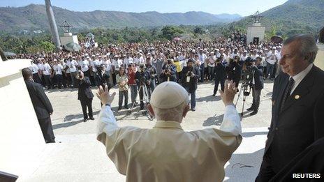 Pope Benedict waves to a crowd in Santiago de Cuba