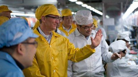 Apple head Tim Cook at a factory in China