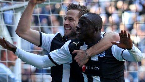 Papiss Cisse (right) celebrates scoring for Newcastle