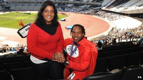 Wendell Raphael (right) proposes marriage to his girlfriend Bindi Bhambra during the Gold Challenge event at the Olympic Stadium