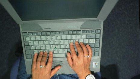 Hands on laptop keyboard