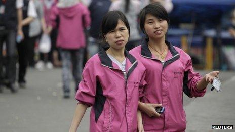 Employees wearing Foxconn uniforms during their lunch break in Shenzhen