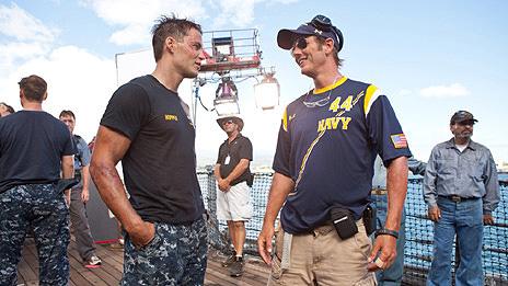 Taylor Kitsch and Peter Berg on the set of Battleship