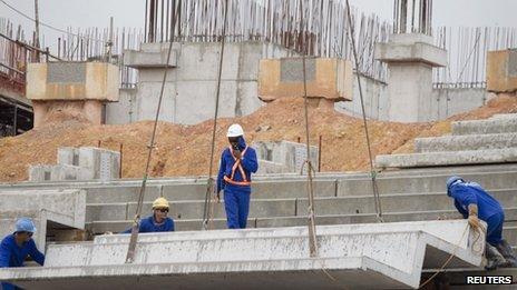 Labourers work on the site of the new Arena da Amazonia stadium, one of the hosts of the 2014 World Cup, in Manaus, the heart of the Brazilian Amazon March 2012.