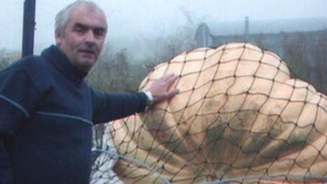 Clive Bevan with a giant pumpkin