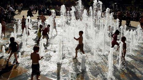 Children playing in a fountain