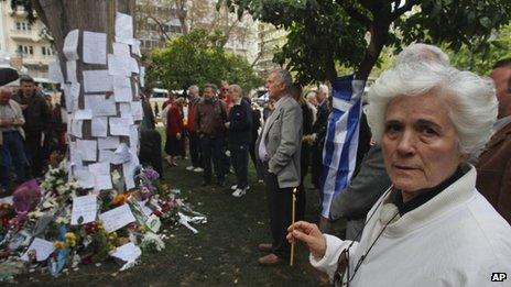 People gather at the spot where Dimitris Christoulas shot himself in Athens, 5 April