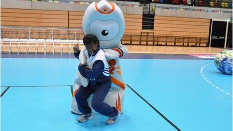 Sisilia Naisiga Rasokisoki taking on Olympic mascot Wenlock in the London 2012 Copper Box