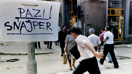 Man running past sniper warning in Sarajevo