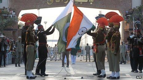 Pakistani Rangers (in black) and Indian Border Security Force (BSF) personnel (in brown) perform the daily retreat ceremony on the India-Pakistan Border at Wagah - 8 January 2012