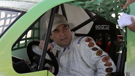 Turkish President Gurbanguli Berdymukhamedov at the wheel of his Turkish-made Volkicar in Ashgabat, 7 April