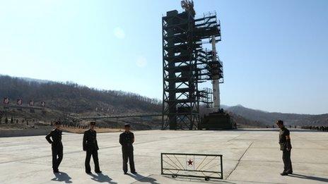 North Korean soldiers on guard in front of the launch site at Tangachai-ri space centre (8 April)