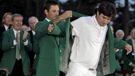 Bubba Watson gets his Green Jacket from 2011 winner Charl Schwartzel