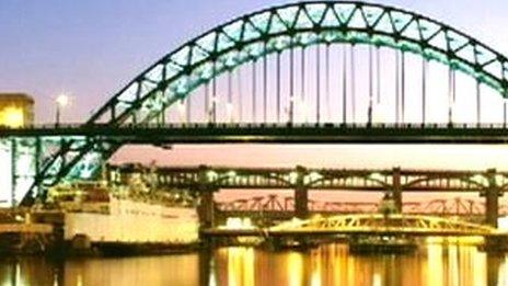 Tyne Bridge at night with Tuxedo Princess moored beneath, on a Royal Mail stamp