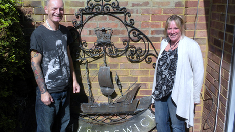 Philip and Lea Newstead with the Walberswick village sign