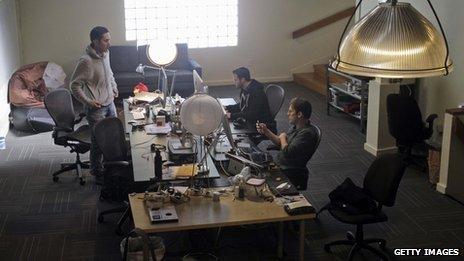 Kevin Systrom, left, chats with engineer Shayne Sweeney, and Mike Krieger (right)